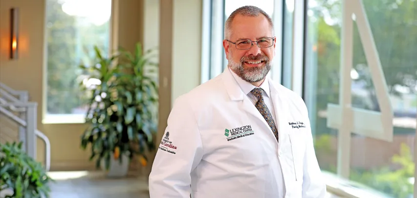 Headshot of Dr. Synder in a hospital lobby.